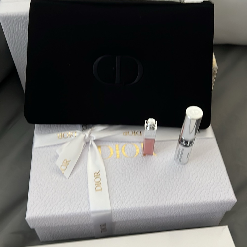 New black, Christian Dior, makeup bag with mascara and small lip gloss maximizer